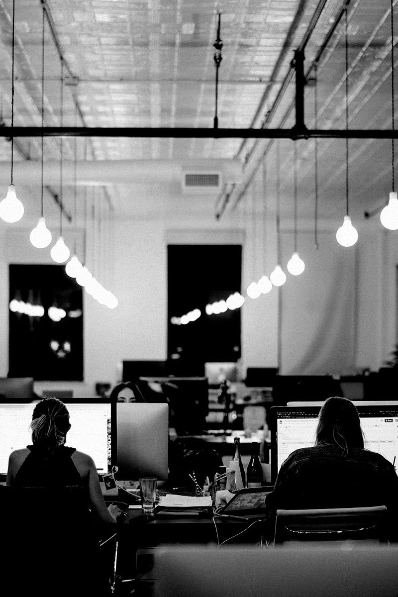 intellectual property-lawyers banner: people working on computer in an industrial office