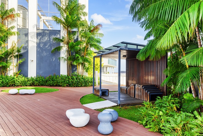 an image of beautiful home garden and yard - image serves as header for community titles scheme in the ACT